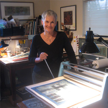 Anne Moore at work in her printmaking studio